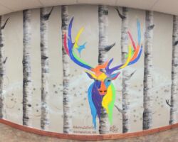 Finished installation on 18 foot concrete wall in public lobby.